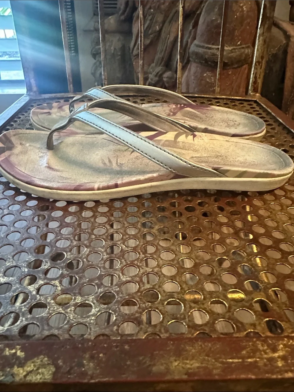 OluKai Metallic Silver Flip Flops with Purple Floral Accent